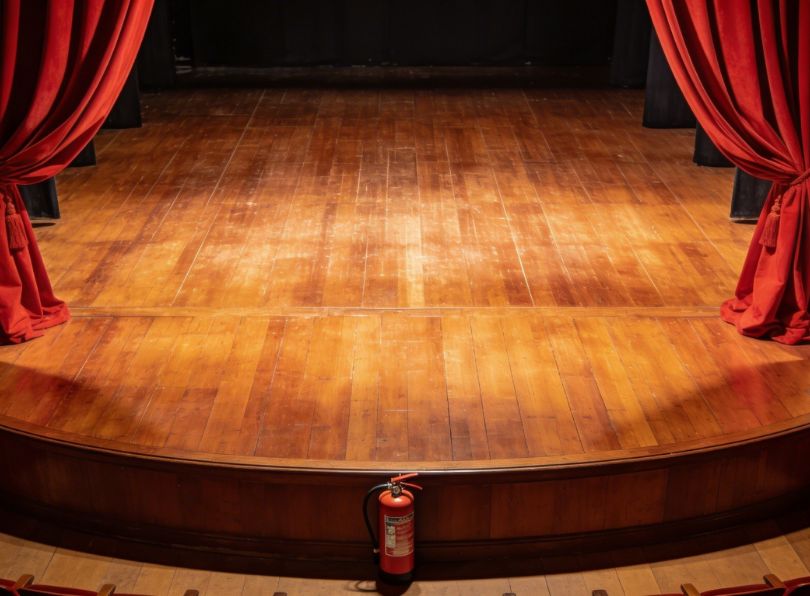 Black profile in theater cove lighting - fire